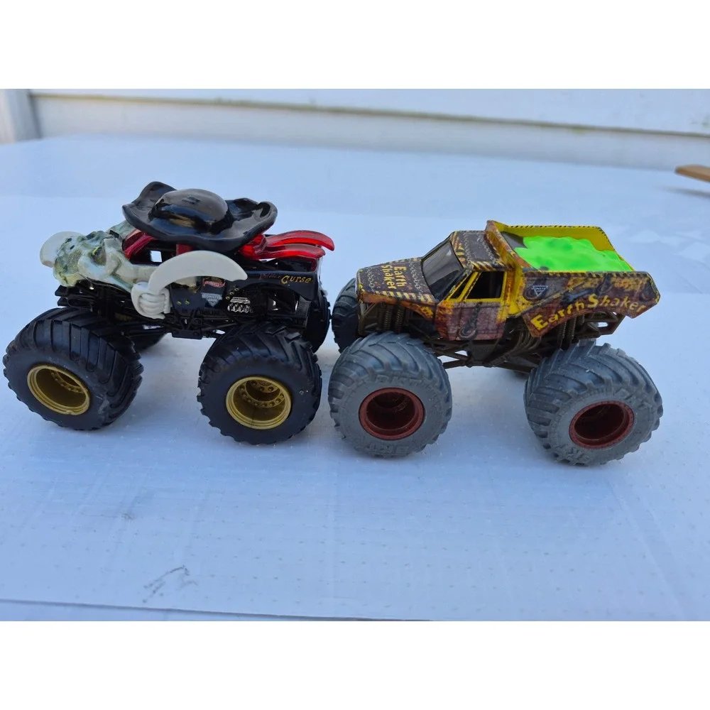 Monster Jam Pirates Curse and Zombie vs Hunter Earth Shaker Die-Cast Truck Lot
